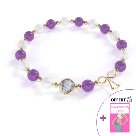 Bracelet amincissant composé d'améthyste et de pierre de lune qui alternent avec de petites billes en or fin entre elles, avec une seule pierre de quartz utile en son centre, entourée d'un anneau en or fin. En cadeau, un défi de 30 jours pour atteindre vos objectifs plus rapidement