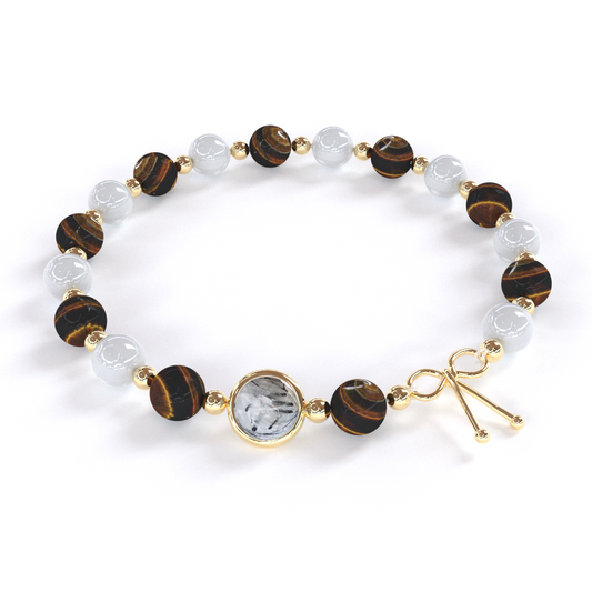 Bracelet Protection composé de pierre naturelle de Œil de Tigre et Pierre de Lune alternant avec de petites billes en or, avec une seule pierre de quartz rutile en son centre, ainsi qu'un noeud en or