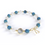 Bracelet  Détoxifiant  composé de pierre naturelle d'Apatite bleue et Pierre de Lune , alternant avec de petites billes en or , avec une seule pierre de quartz rutile en son centre, ainsi qu'un noeud en or